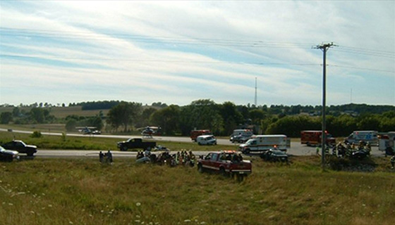 Crews from multiple agencies work together on scene at a multi-vehicle accident on Highway 23